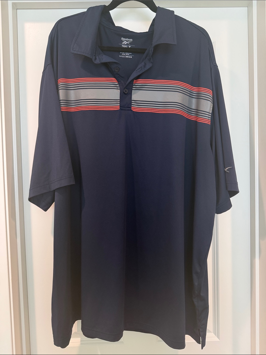 Reebok Men’s Navy Polo With Orange And Gray Chest Stripes